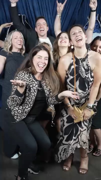 S&S event guests celebrating together in a live Red Carpet Robot Max glambot output